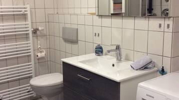 Combined shower/tub, hair dryer, towels, toilet paper