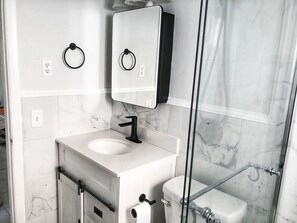 Combined shower/tub, hair dryer, towels, soap