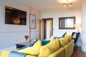 Apartment, Mehrere Betten | Wohnzimmer