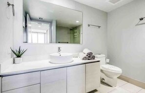 Combined shower/bathtub, hair dryer, towels, soap