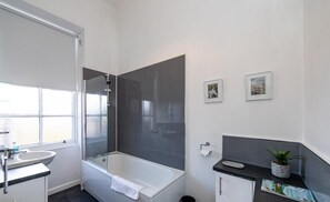 Apartment, Multiple Beds | Bathroom | Combined shower/tub, deep soaking tub, hair dryer, towels