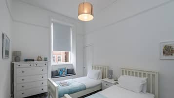 Apartamento, várias camas | 2 quartos, ferros/tábuas de passar roupa, Wi-Fi de cortesia