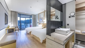 A hotel room with two beds, a desk, a large window, and a modern bathroom with a large mirror and sink. - Hongting International Hotel(Central Lake District Store) (Hangzhou)