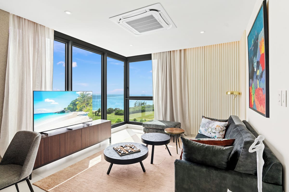 Comfort Apartment, 1 King Bed, Beach View | Living area | Smart TV