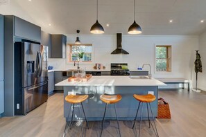 Fridge, microwave, cookware/dishes/utensils, dining tables