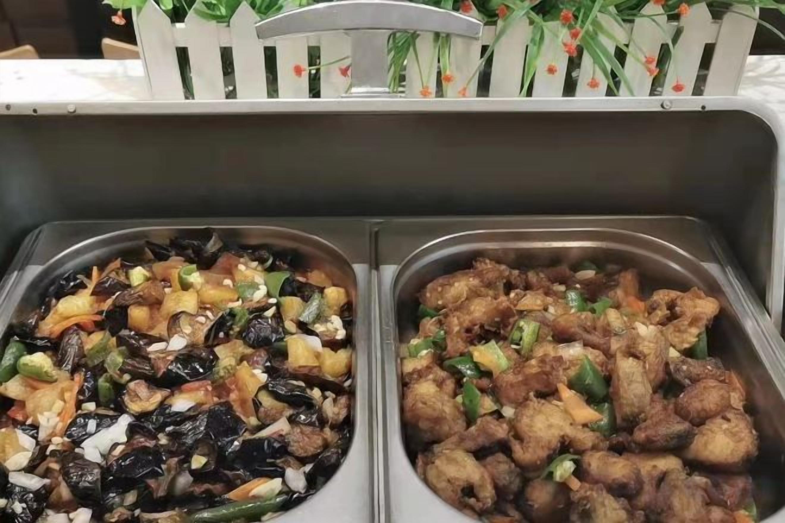 Two food service trays with various dishes.