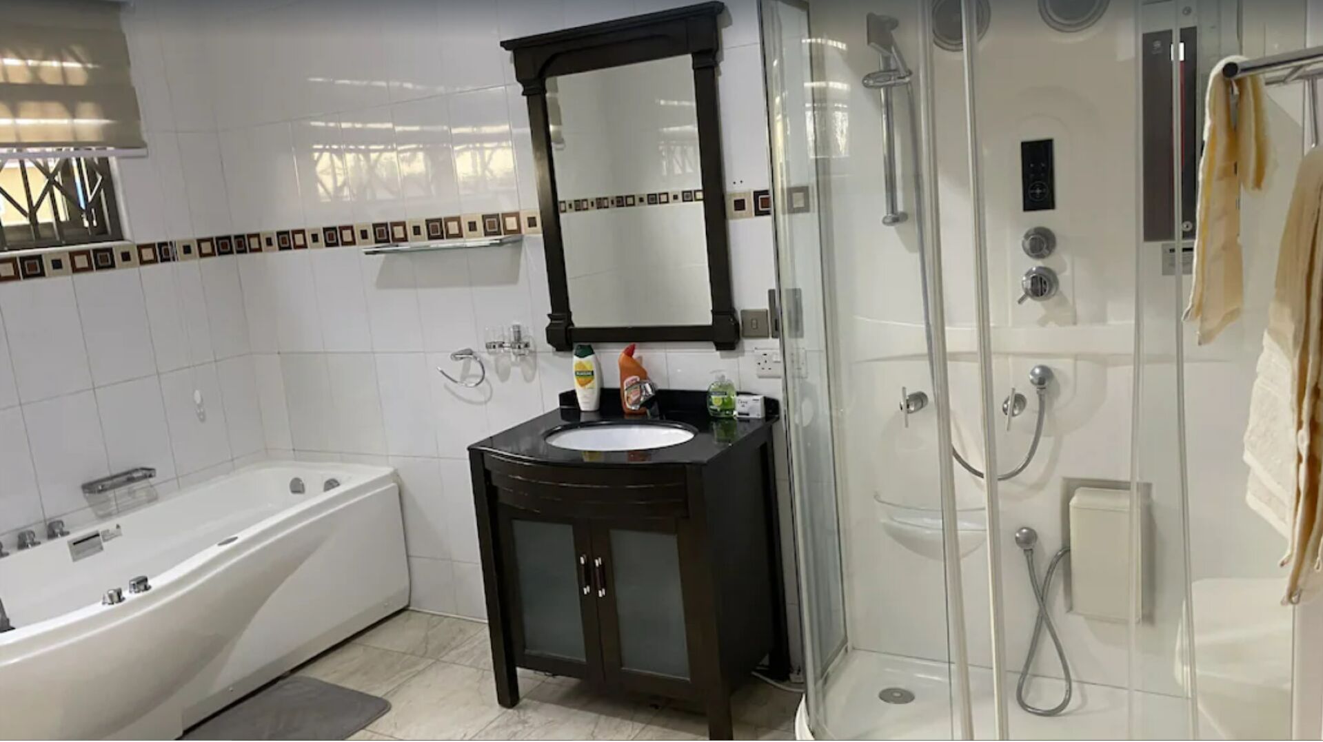 Bathtub, hair dryer, towels, soap
