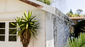 A water feature with a plant in front of a building. - Yanderra - Discover relaxation at this charming cottage opposite the beachside golf course (Mollymook)