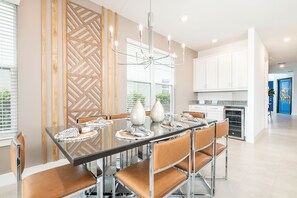Enjoy meals in this stylish dining area with a glass-top table and comfortable seating for six.