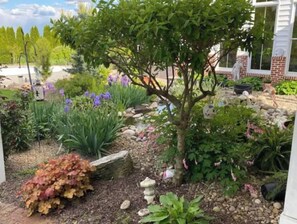 Stroll through the serene garden, surrounded by lush greenery and vibrant flowers.