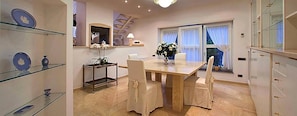 Enjoy cooking in this well-equipped kitchen with a central island and seating area.