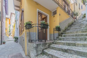 Stroll down this charming street to a historic building with a welcoming entrance.