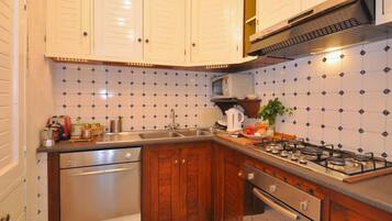 Villa | Private kitchen | Cookware/dishes/utensils, dining tables