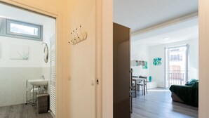 A modern apartment with a bathroom, a dining area, and a living room. - Co-c933-ggar24c4 - Central Green Apartment (Como)