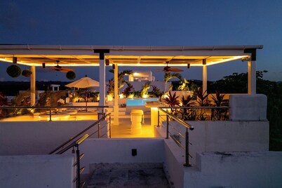 New Boho-Chic Beachfront Penthouse w/Dior inspired Rooftop Oasis & Infinity Pool