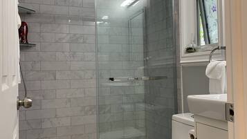 Shower, hair dryer, towels, soap