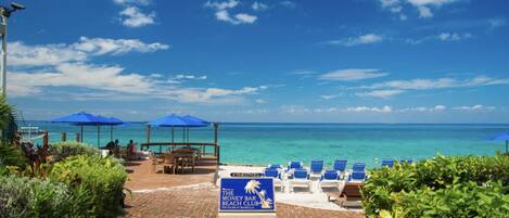 On the beach, sun loungers, beach towels