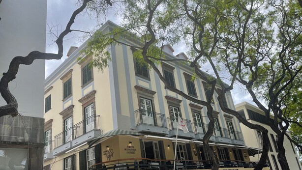 A multi-story building with a cafe on the ground floor named 'Bazar Cafe'. - Pier House Accommodation (Funchal)