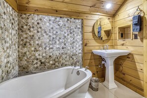 Bathtub, towels, toilet paper