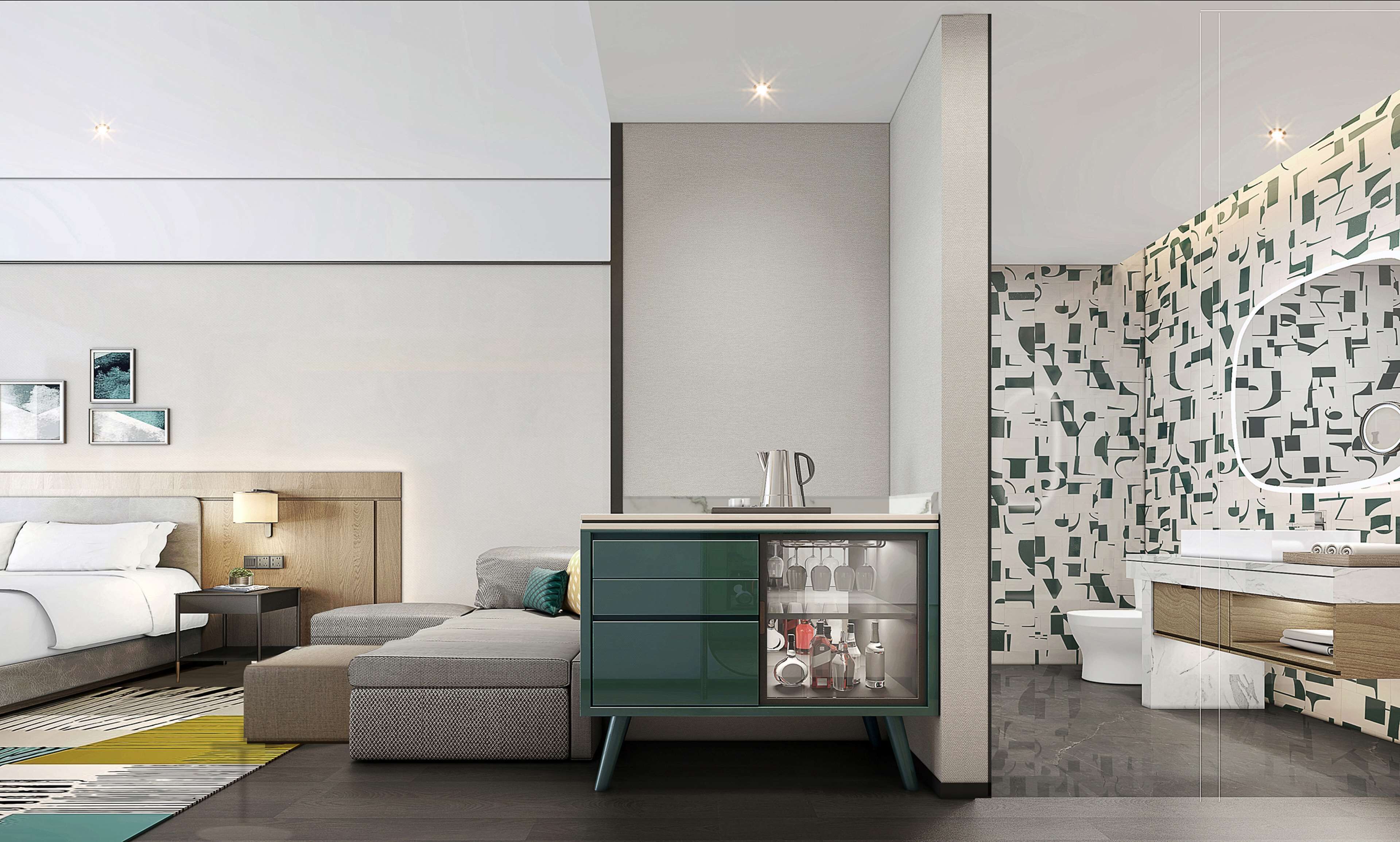 Una habitación de hotel moderna con una cama, un mini bar verde, un baño con pared estampada y un espejo grande.
