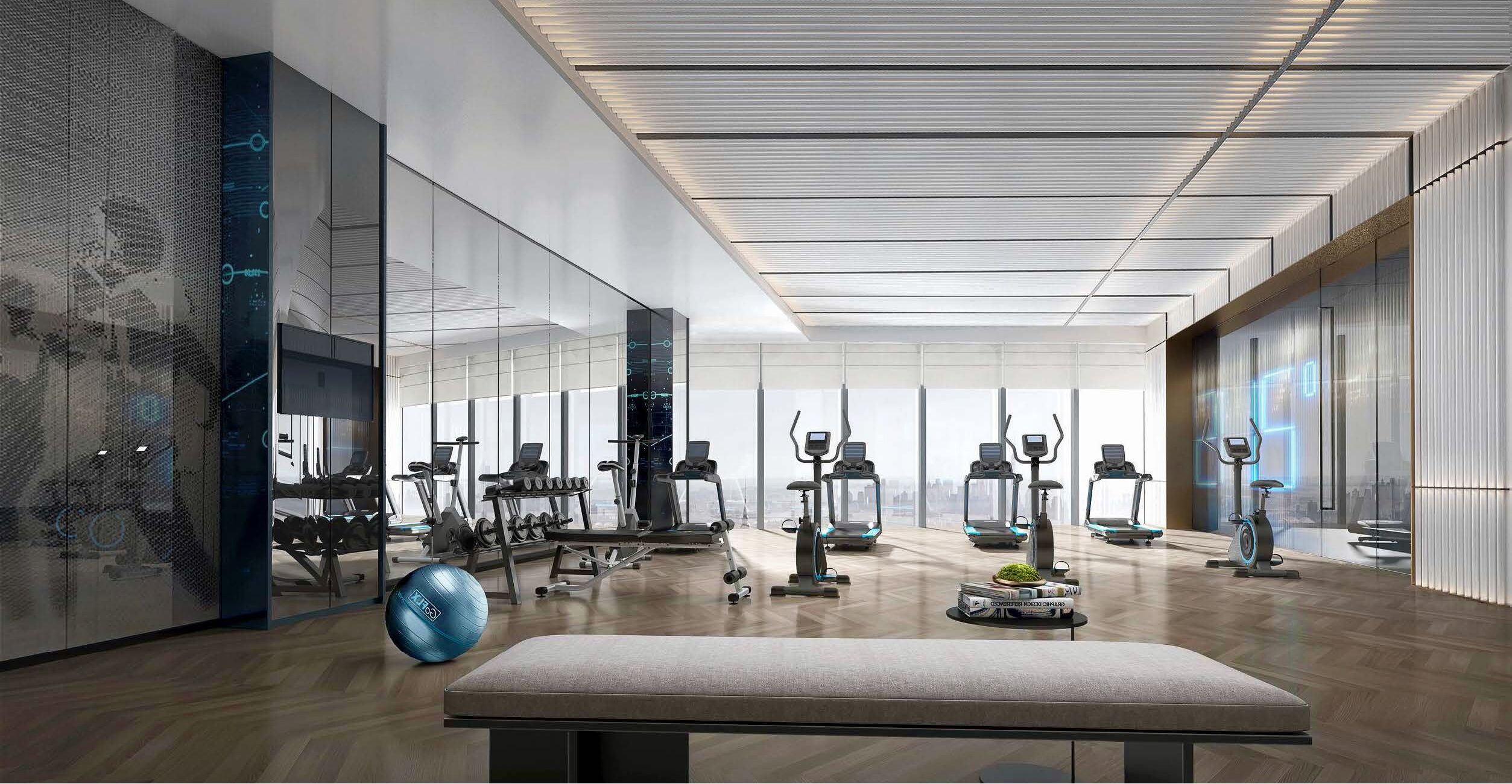 A modern gym with various exercise equipment, a bench, and a large window providing a city view.