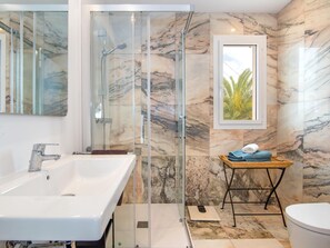 Bathtub, hair dryer, towels