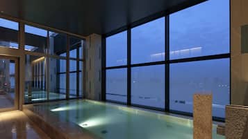 Swim and enjoy the city view from our indoor pool area, surrounded by a spacious floor and glass barrier.