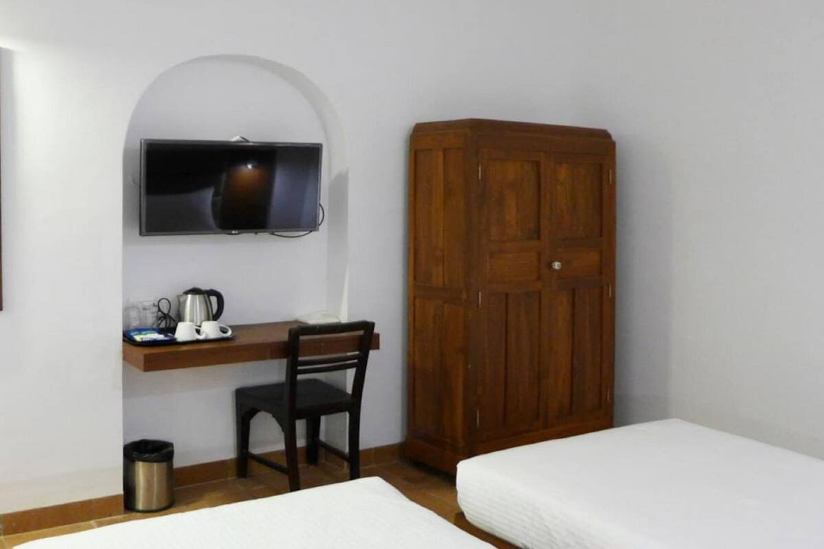 Desk, laptop workspace, free WiFi, bed sheets