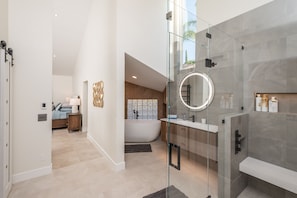 Combined shower/bathtub, hair dryer, towels, soap