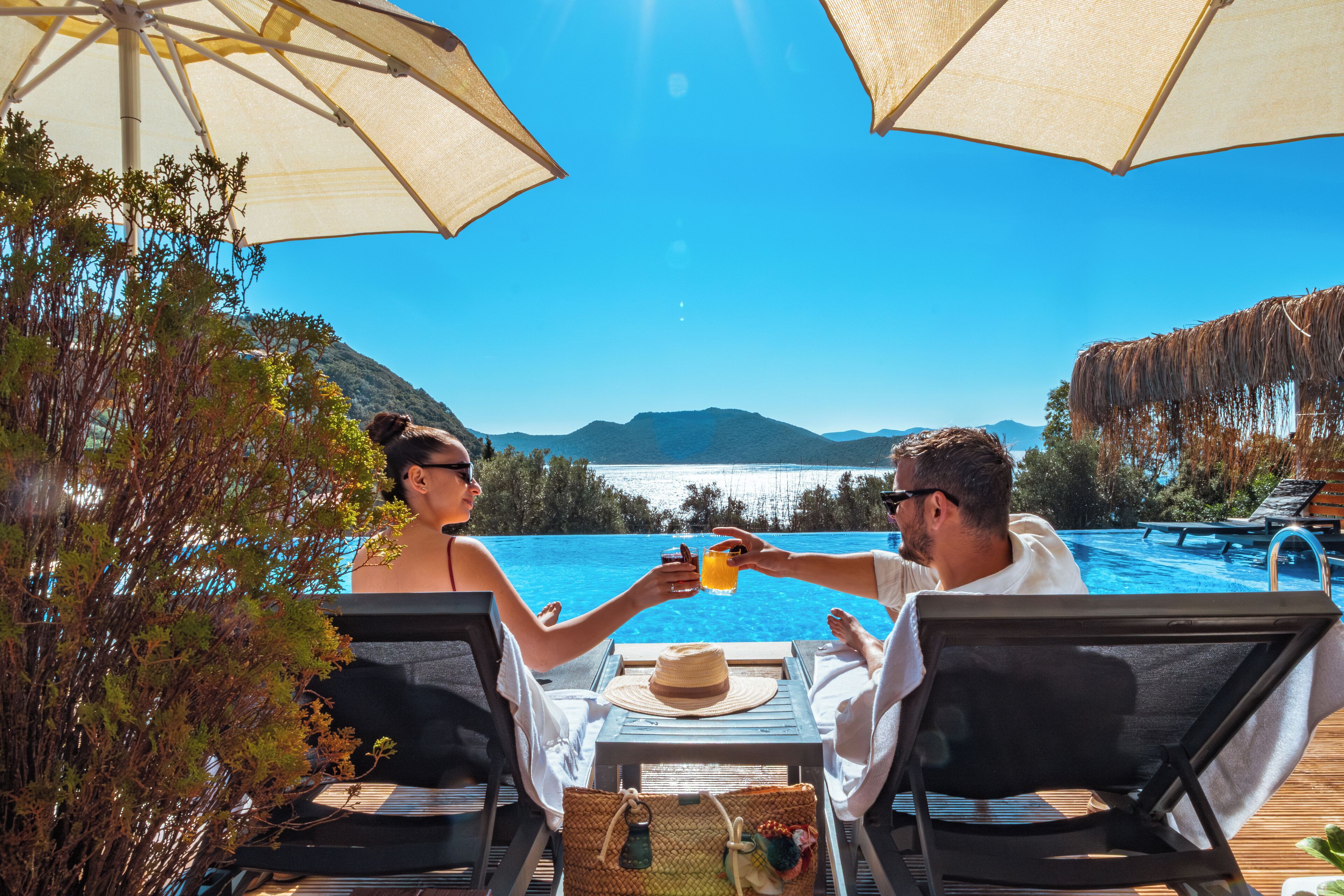 Outdoor pool, open 10:00 AM to 8:00 PM, pool umbrellas, pool loungers