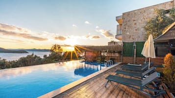 Outdoor pool, open 10:00 AM to 8:00 PM, pool umbrellas, sun loungers