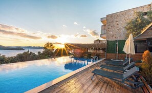 Outdoor pool, open 10:00 AM to 8:00 PM, pool umbrellas, sun loungers