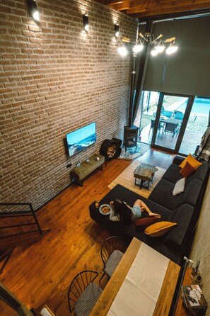 Premium Bungalow | Living area | 50-inch LCD TV with satellite channels, TV, Netflix