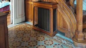 A wooden staircase with a handrail and a radiator at the bottom. - Village property in the Perche region with basic shops and SNCF train station. (Sablons sur huisne)