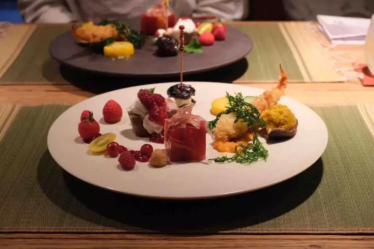 A dining table with two plates of food.