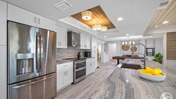 House | Private kitchen | Fridge, highchair, cookware/dishes/utensils, dining tables