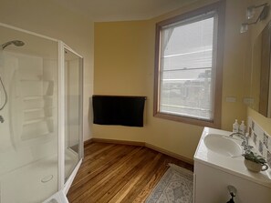 Shower, hair dryer, towels, soap