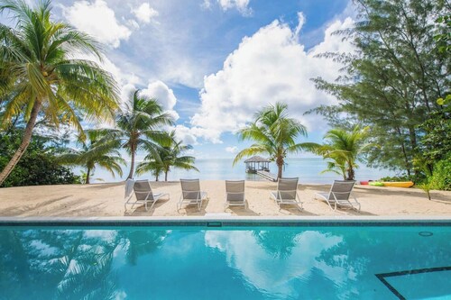 White Cottage: Deluxe Oceanfront Home w/Backyard Beachfront, Private Pool, Dock