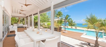 White Cottage: Deluxe Oceanfront Home w/Backyard Beachfront, Private Pool, Dock