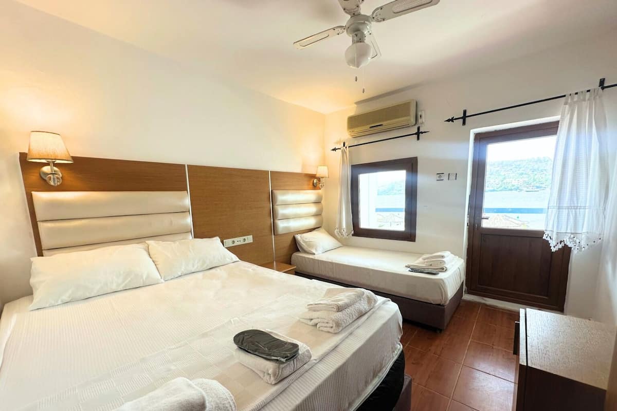 Deluxe Triple Room, Sea View | Premium bedding, desk, free WiFi