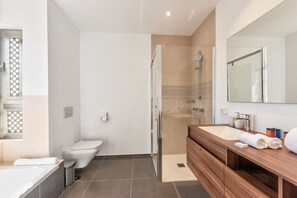 Bathtub, hair dryer, towels