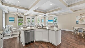 A spacious kitchen with white cabinetry, a granite countertop, and a built-in dishwasher. - Private Pool, Pet Friendly, and Beach Access- Sea-Rest by Royal Destinations (Inlet Beach)