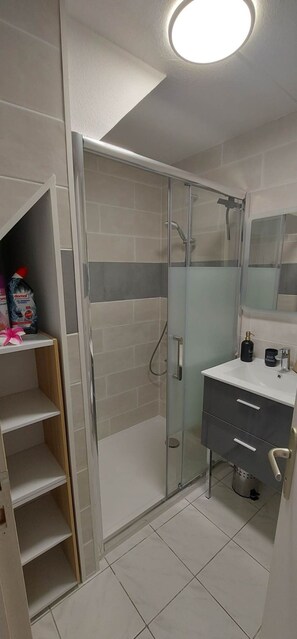 Shower, hair dryer, soap, shampoo