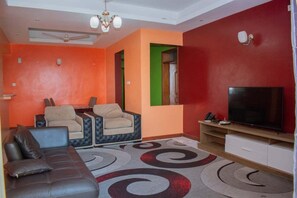 Classic Apartment | Living area | TV - Stay.Plus Penthouse with a DSQ in Nyali (Mombasa)