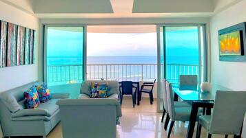 Premium Apartment (1003) | Living area | 32-inch flat-screen TV with cable channels, TV