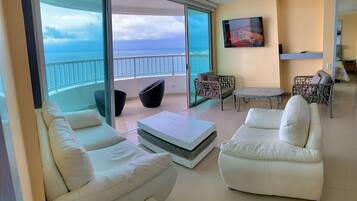 Premium Apartment (3203) | Living area | 32-inch flat-screen TV with cable channels, TV
