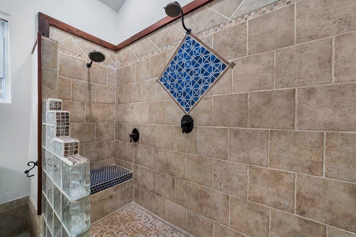 Shower, hair dryer, towels, shampoo
