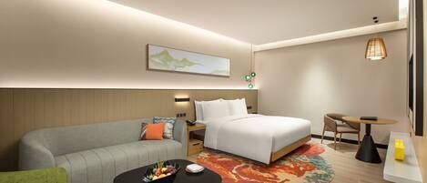 A modern hotel room with a bed, a sofa, a small table, and a desk.