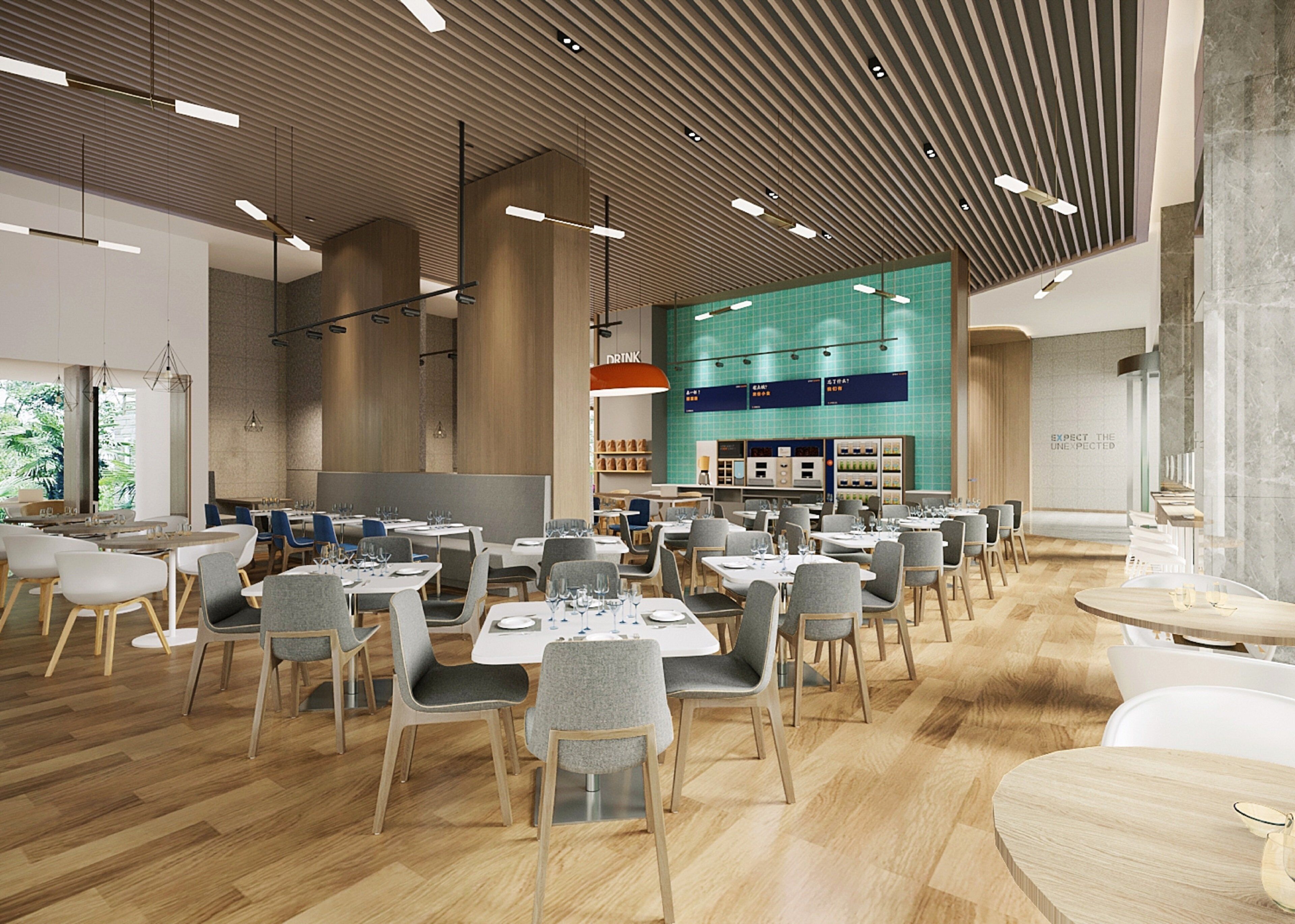 A spacious restaurant with high ceilings, modern lighting, and a central bar area.