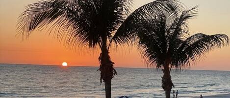 On the beach, sun-loungers, beach towels